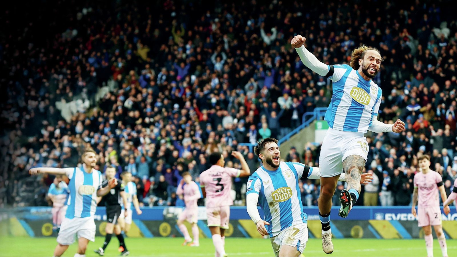 Huddersfield Town scorer Marcus Harness jumps for joy after finding the net for his side