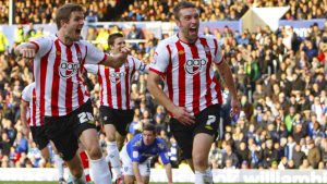 Rickie Lambert celebrates putting Southampton ahead at Fratton Park in December 2011