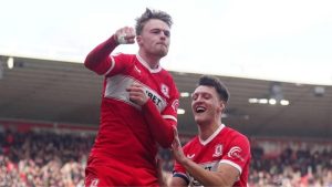 Tommy Conway, left, celebrates with Dael Fry after scoring his second and Middlesbrough’s fourth