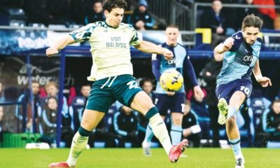 Wycombe Wanderers’ Luke Leahy takes a shot at goal under pressure from Cardiff City forward Yousef Salech