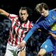 Birmingham City’s August Priske and Stoke City’s Ashley Phillips battle for the ball