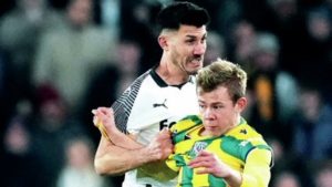 Derby’s Danny Batth and West Brom’s Aune Heggebo do battle