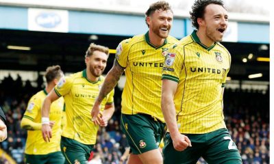 Oliver Rathbone celebrates with his Wrexham team-mates