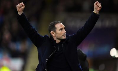 Frank Lampard holds his arms aloft