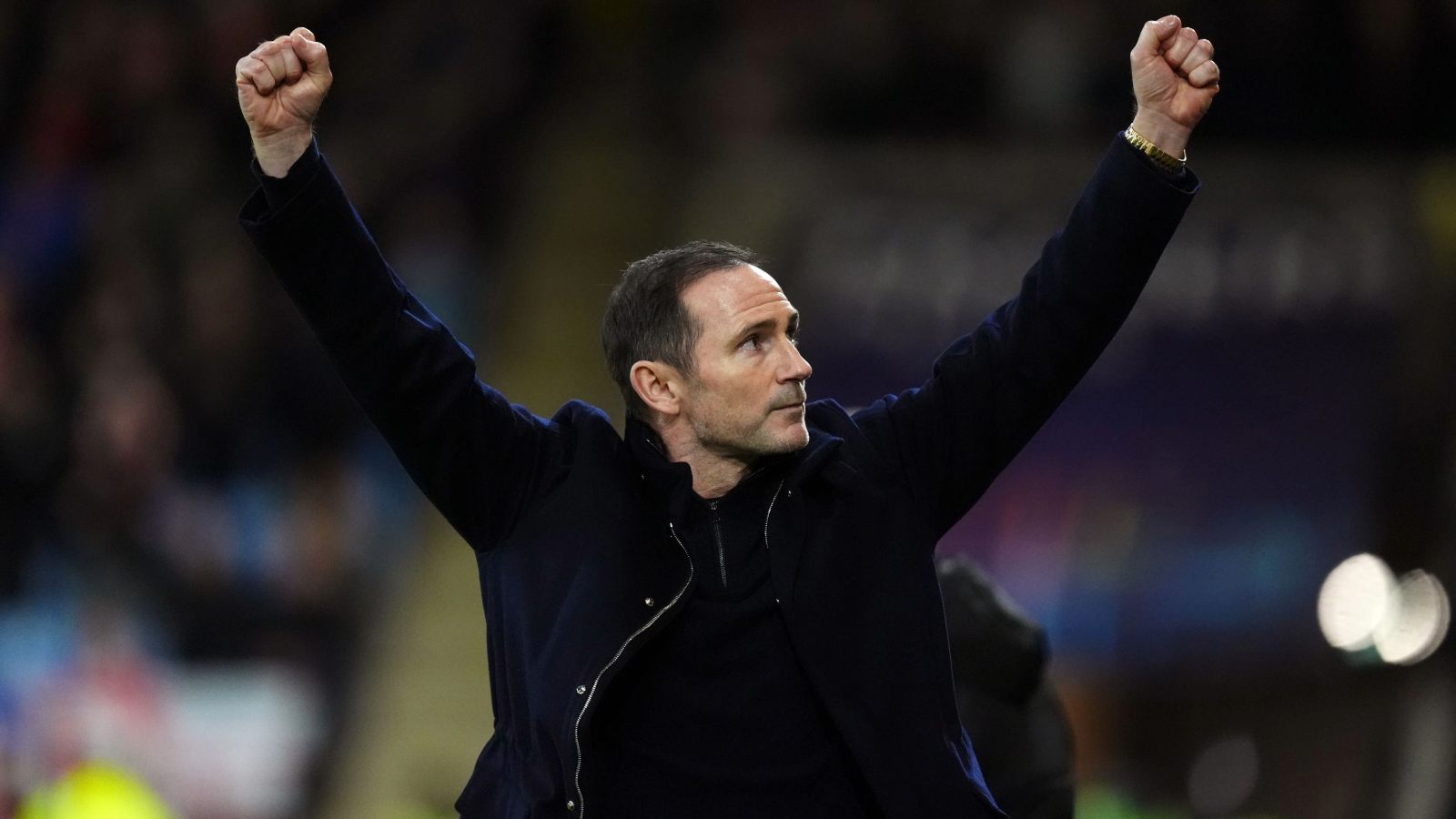 Frank Lampard holds his arms aloft