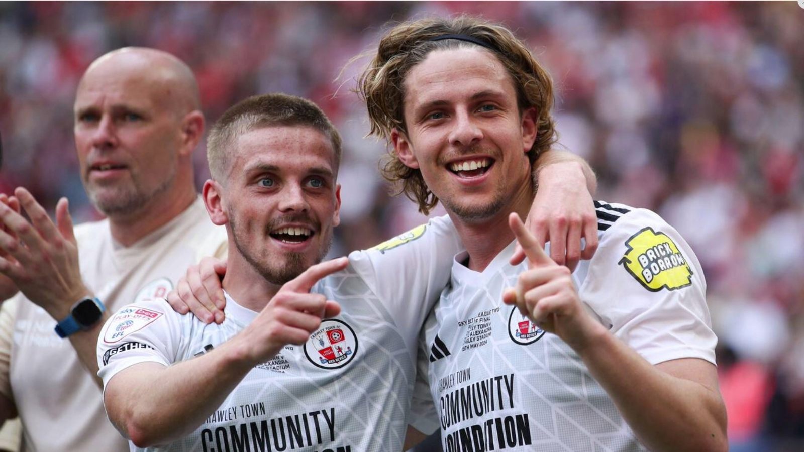 Crawley Town’s Ronan Darcy, left, and Danilo Orsi celebrate their League Two play-off final victory in 2024