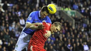 Gary Caldwell playing for Wigan Athletic against Liverpool