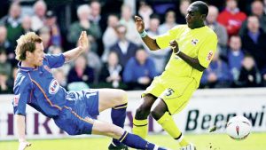 Gavin Cowan powers into a challenge in his Shrewsbury Town playing days in 2005