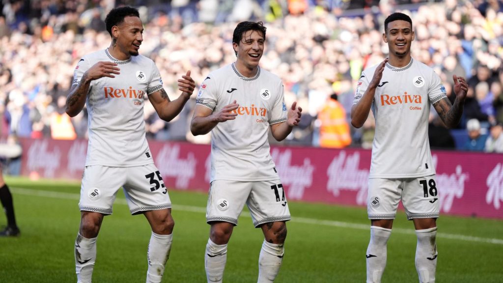 Goncalo Franco celebrates scoring for Swansea City against Sheffield Wednesday with team mates Ronald and Gustavo Nunes