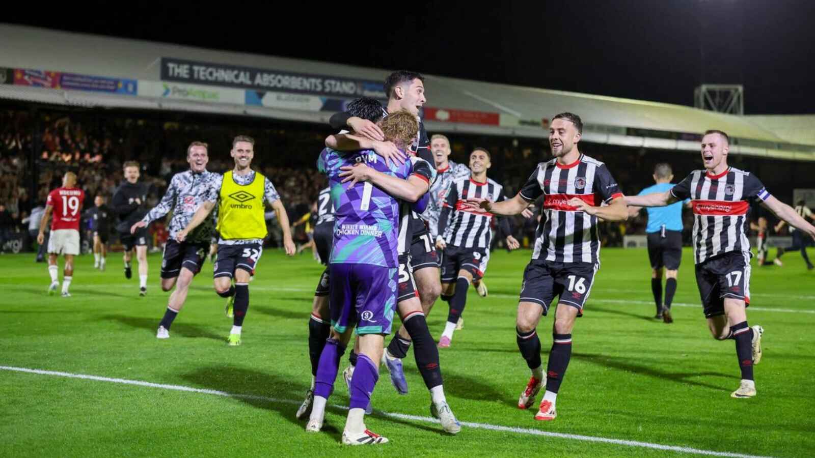 Grimsby Town celebrate knocking Manchester United out of the Carabao Cup
