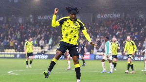 Harrogate Town’s Emmerson Sutton jumps for joy after doubling his side’s lead in style