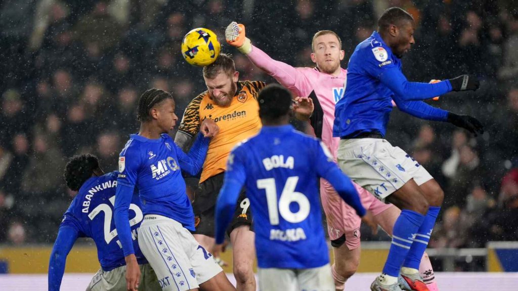 Watford goalkeeper Egil Selvik clears the ball whilst under pressure