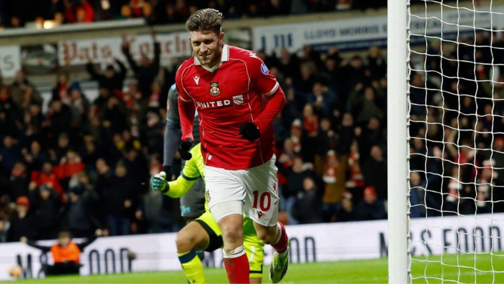 Josh Windass celebrates his decisive goal for Wrexham