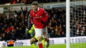 Josh Windass celebrates his decisive goal for Wrexham