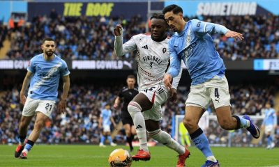 Manchester City’s Tijjani Reijnders holds off Salford City’s Rosaire Longelo