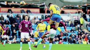 Mansfield Town’s Rhys Oates rises high to level against Burnley