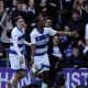 Richard Kone, centre, celebrates his equaliser for QPR