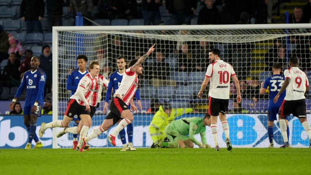 Ryan Manning (centre) celebrates