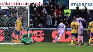Lincoln City’s Tom Bayliss celebrates making it 2-0
