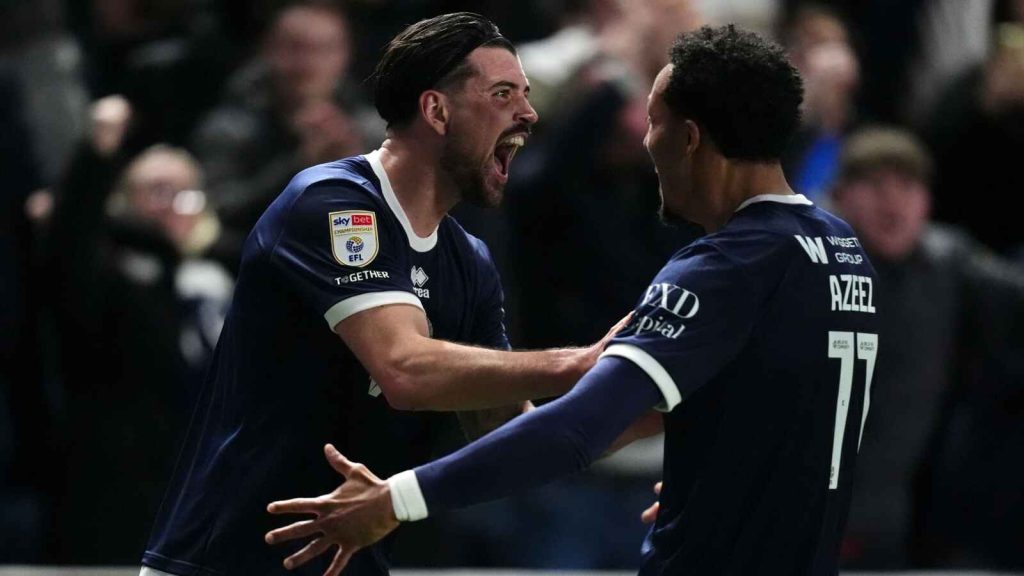 Tristan Crama celebrates with Millwall team-mate Femi Azeez
