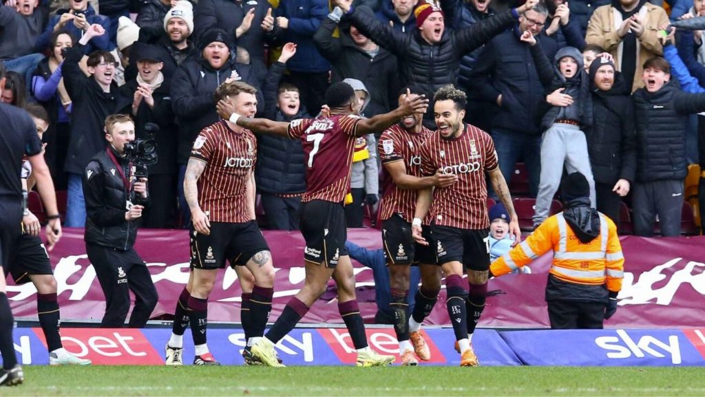 Tyreik Wright, right, celebrates with his Bradford City team-mates