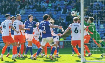 Blackpool goalkeeper Bailey Peacock-Farrell makes a flying save against Cardiff City last weekend