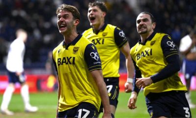 Oxford United celebrate their third goal, scored by Ciaron Brown, right