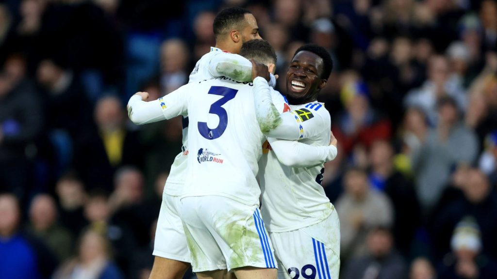 Leeds United’s Gabriel Gudmundsson, left, celebrates with Wilfried Gnonto, right