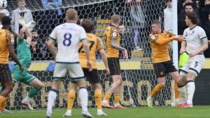 Jake Cooper, right, scores Millwall’s first goal
