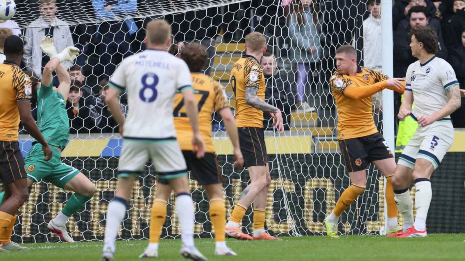 Jake Cooper, right, scores Millwall’s first goal