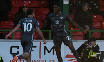 Milton Keynes Dons’ Marvin Ekpiteta celebrates scoring his side’s second with Aaron Collins