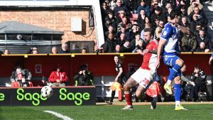 Swindon Town’s Ollie Palmer scores