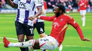 Salford City’s Rosaire Longelo shoots