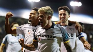 Derby County’s Sam Szmodics (centre) celebrates with team-mates