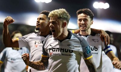 Derby County’s Sam Szmodics (centre) celebrates with team-mates