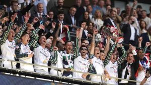 Sunderland players celebrate promotion to the Premier League in 2025 after their play-off final success against Sheffield United