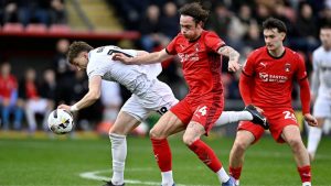 Leyton Orient’s Theo Archibald, centre, battles for the ball against Barnsley last month