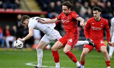 Leyton Orient’s Theo Archibald, centre, battles for the ball against Barnsley last month