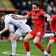 Leyton Orient’s Theo Archibald, centre, battles for the ball against Barnsley last month