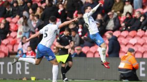 Portsmouth’s Conor Chaplin enjoys his winner with the travelling supporters