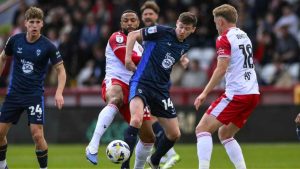 Conor McGrandles battles for the ball in Lincoln City’s 2-2 draw at Stevenage