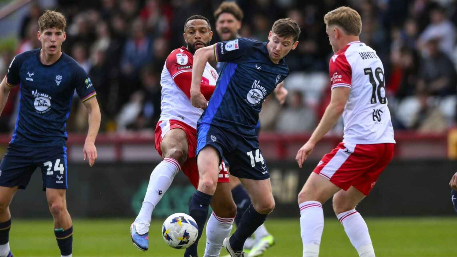 Conor McGrandles battles for the ball in Lincoln City’s 2-2 draw at Stevenage