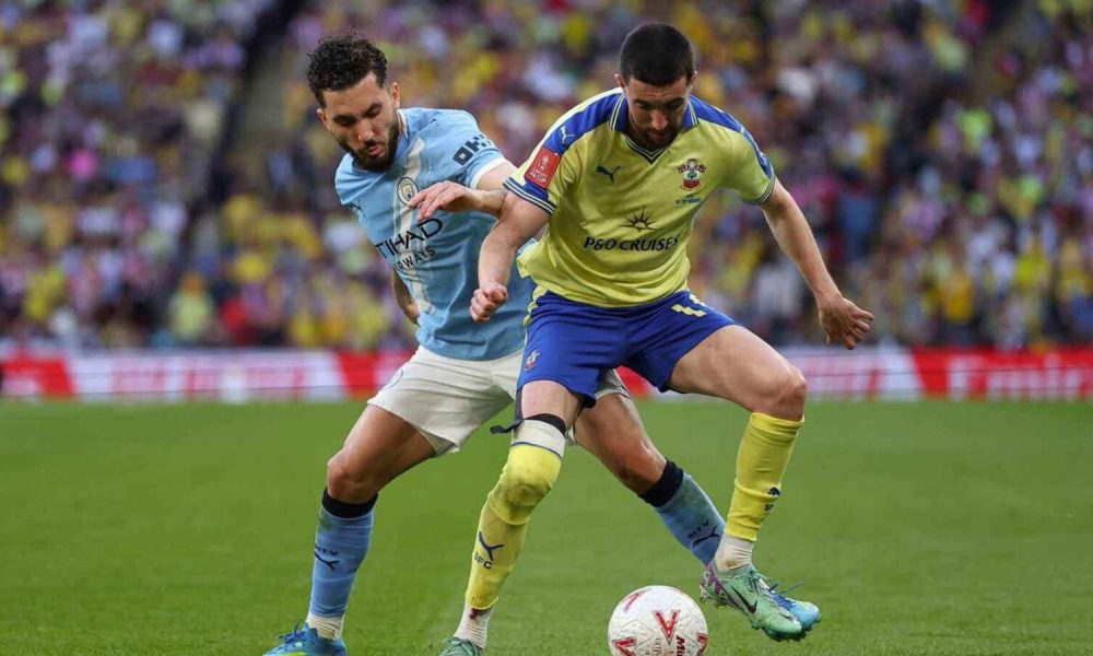 Southampton’s Finn Azaz is shadowed by Manchester City’s Rayan Cherki