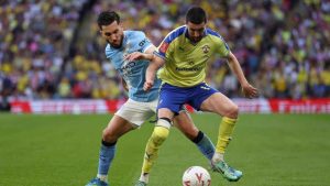 Southampton’s Finn Azaz is shadowed by Manchester City’s Rayan Cherki