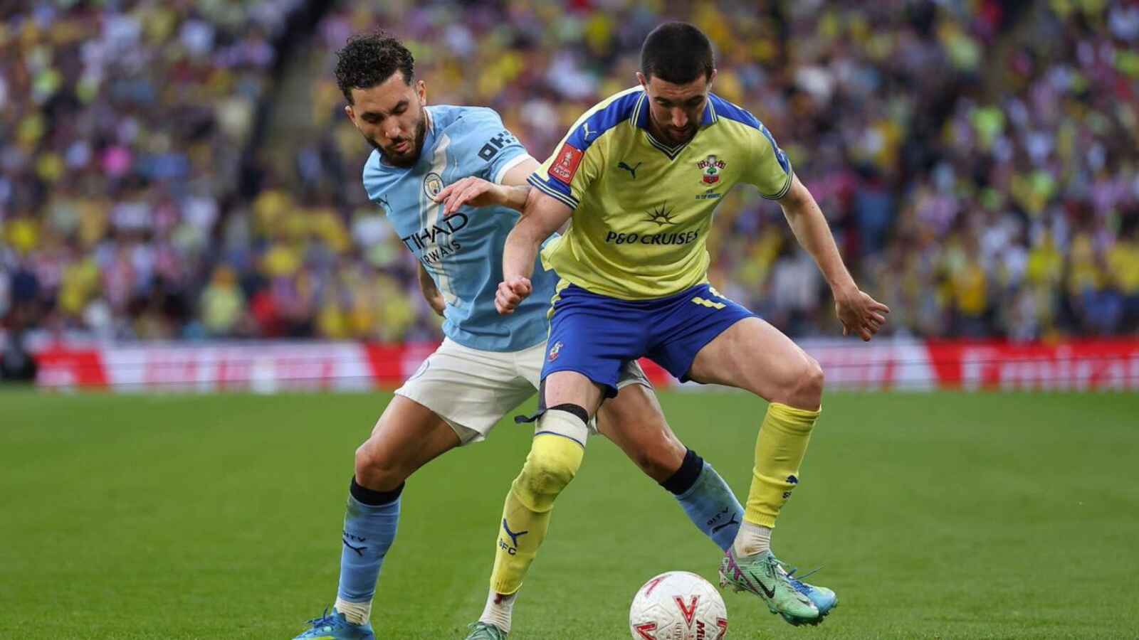 Southampton’s Finn Azaz is shadowed by Manchester City’s Rayan Cherki