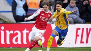 Mansfield Town’s George Abbott, right, battles with Arsenal whizz-kid Max Dowman in the FA Cup