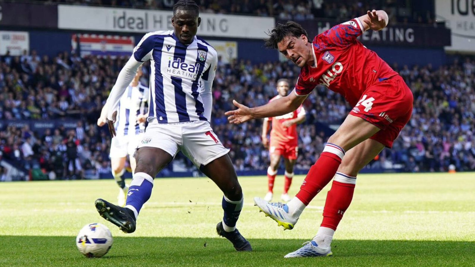 Ipswich Town’s Jacob Greaves, right, shoots under pressure from West Bromwich Albion’s Ousmane Diakite