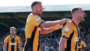James Gibbons celebrates scoring Cambridge United’s second goal