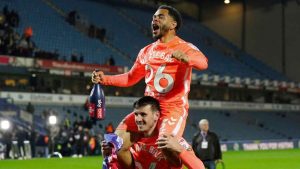 Jay Dasilva, top, and Liam Kitching savour Coventry City’s promotion to the Premier League