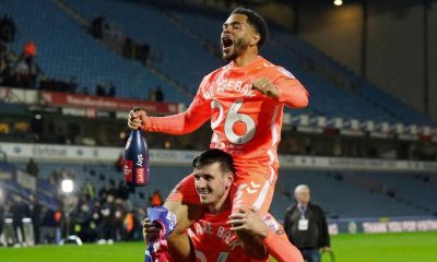 Jay Dasilva, top, and Liam Kitching savour Coventry City’s promotion to the Premier League